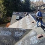 denver roofers installing underlayment and skylight