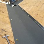 denver roofing contractor installing underlayment