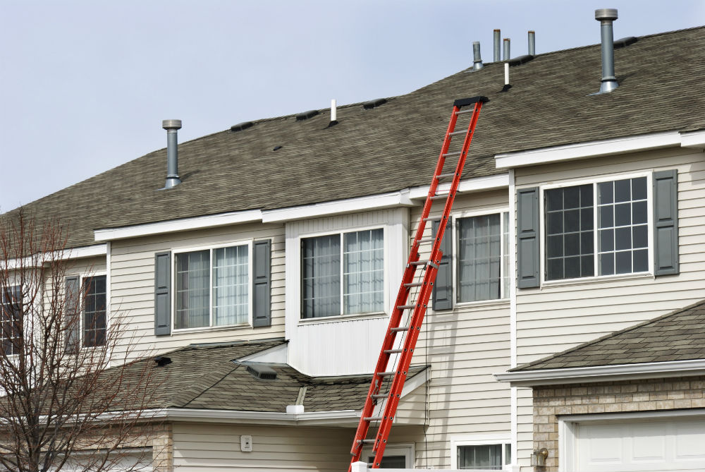 What Is the Risk of Hiring an Uninsured Roofer for Your Multi-Family Roof Repair?