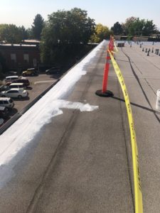 denver flat roof restored with caution tape