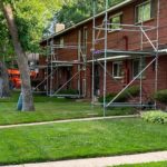 multifamily roofing construction with scaffolding