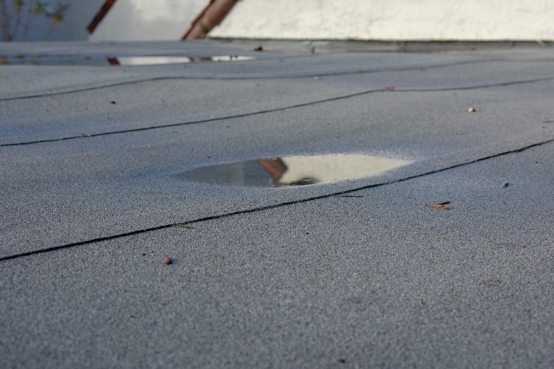 sagging roof with puddle