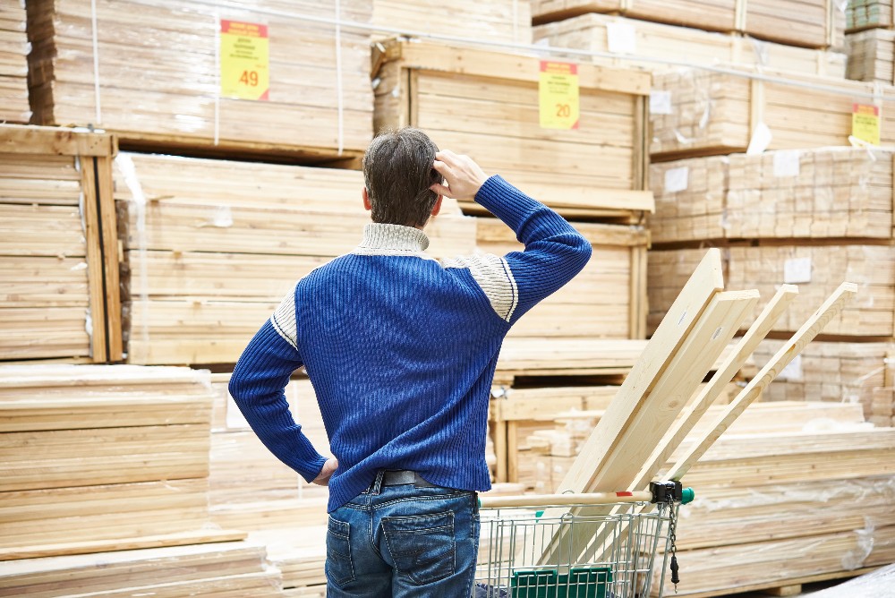 man wondering why lumber prices are so high