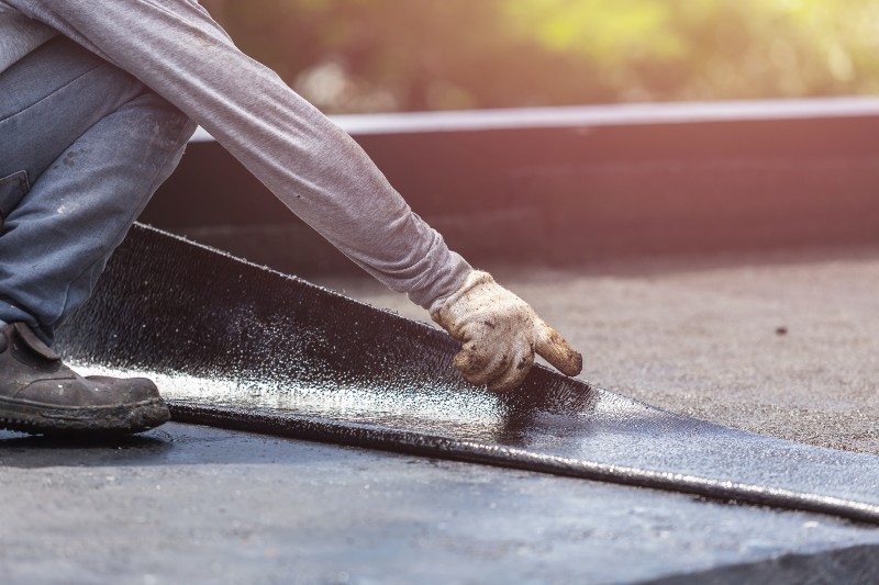 installing roofing material for flat roof